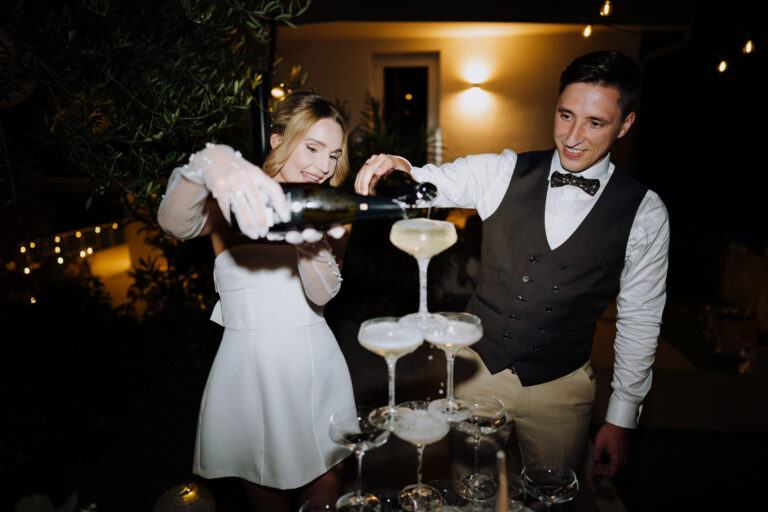 Champagne tower, candid wedding party moment