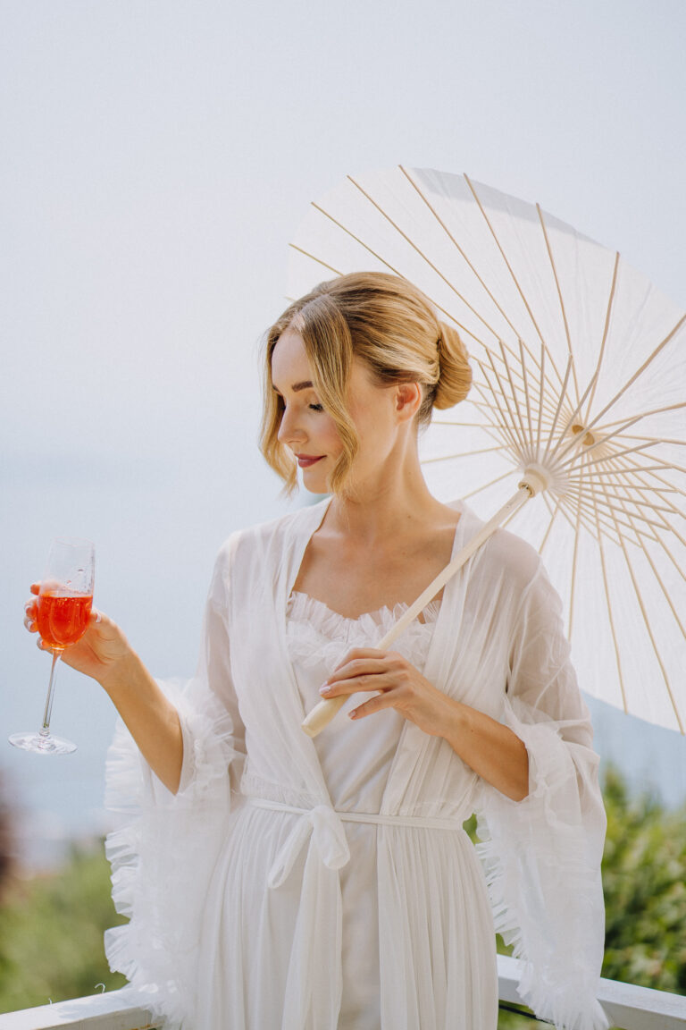 Bride portrait with parasol, elegant destination wedding style