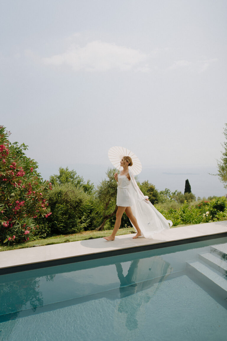 Bride portrait outdoors with Lake Garda view.