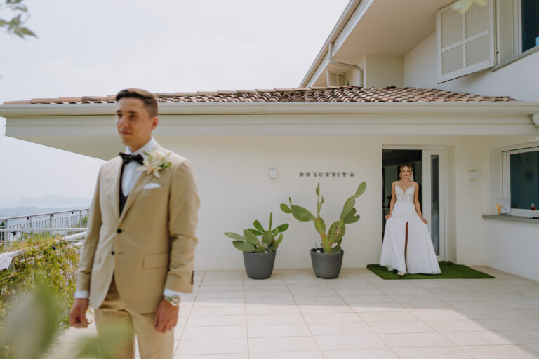 Groom waiting outside, first look moment at Lake Garda villa