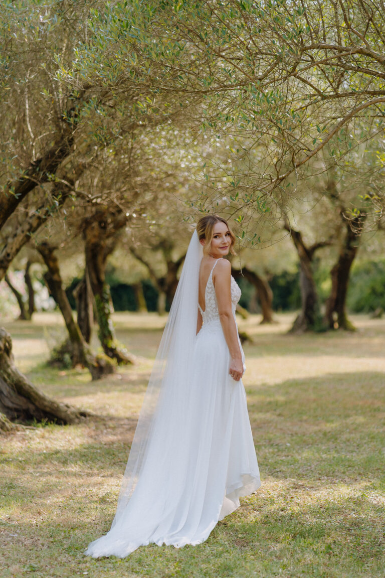 Bride in her dress walking outdoors, Lake Garda