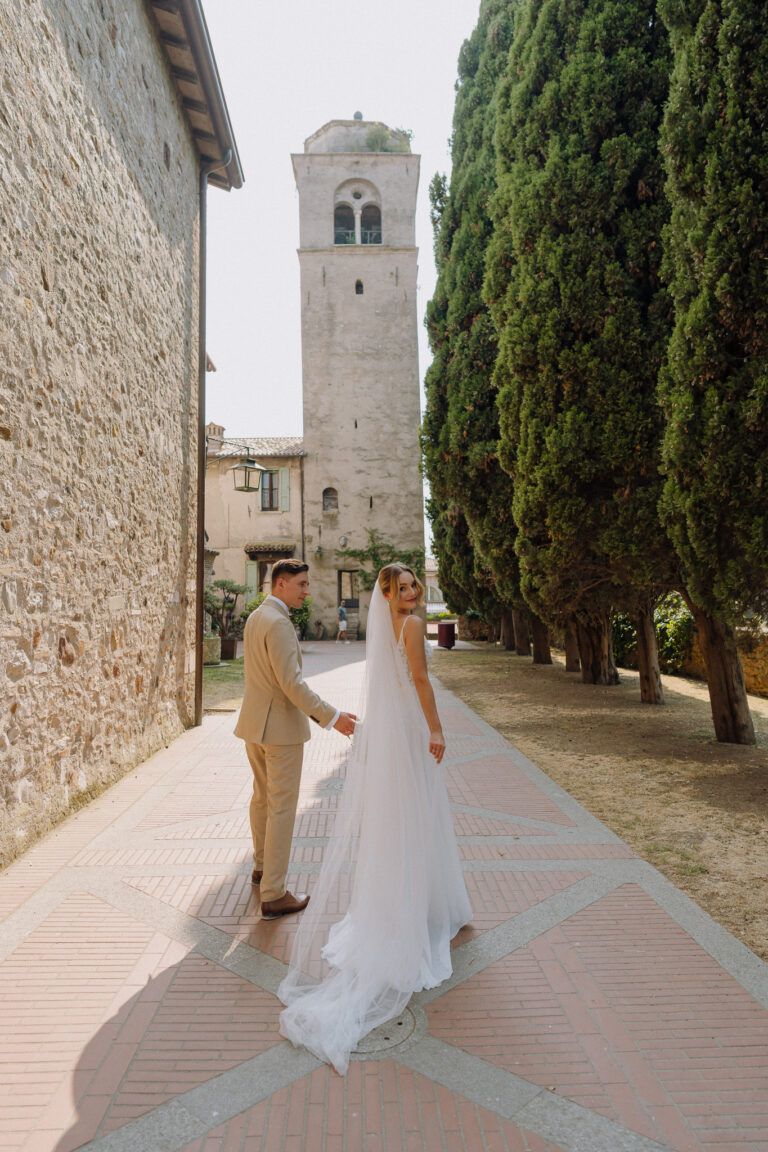 Bride and groom walking through Sirmione, Lake Garda wedding