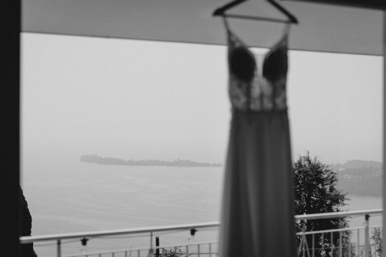 Wedding dress hanging during preparations near Lake Garda