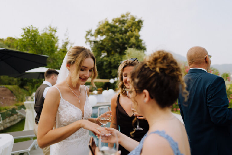 Bride and groom during aperitivo at the villa, Lake Garda