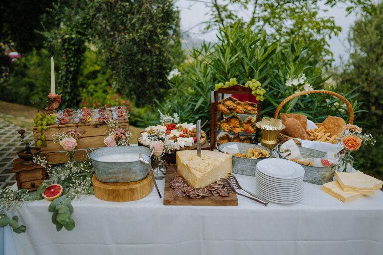 Aperitivo table with food and drinks, villa wedding Lake Garda
