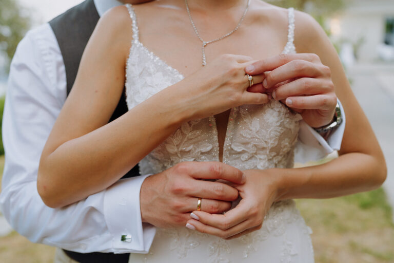 Couple embrace close-up, intimate wedding moment