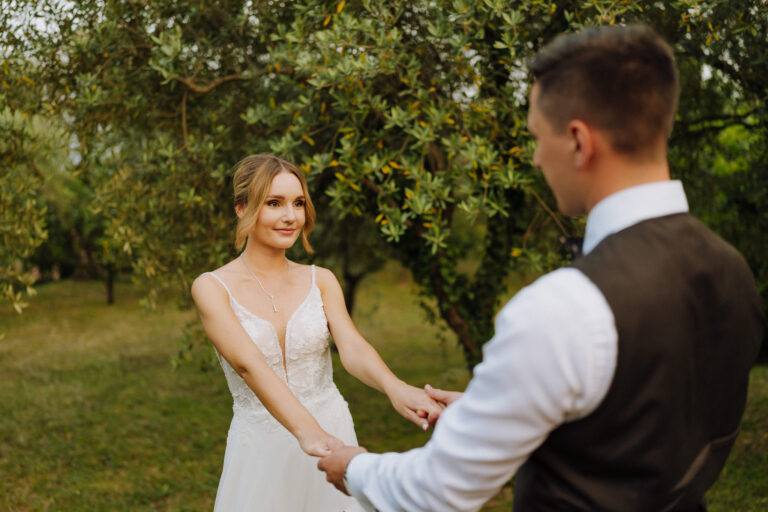 Couple dancing outdoors, candid wedding moment
