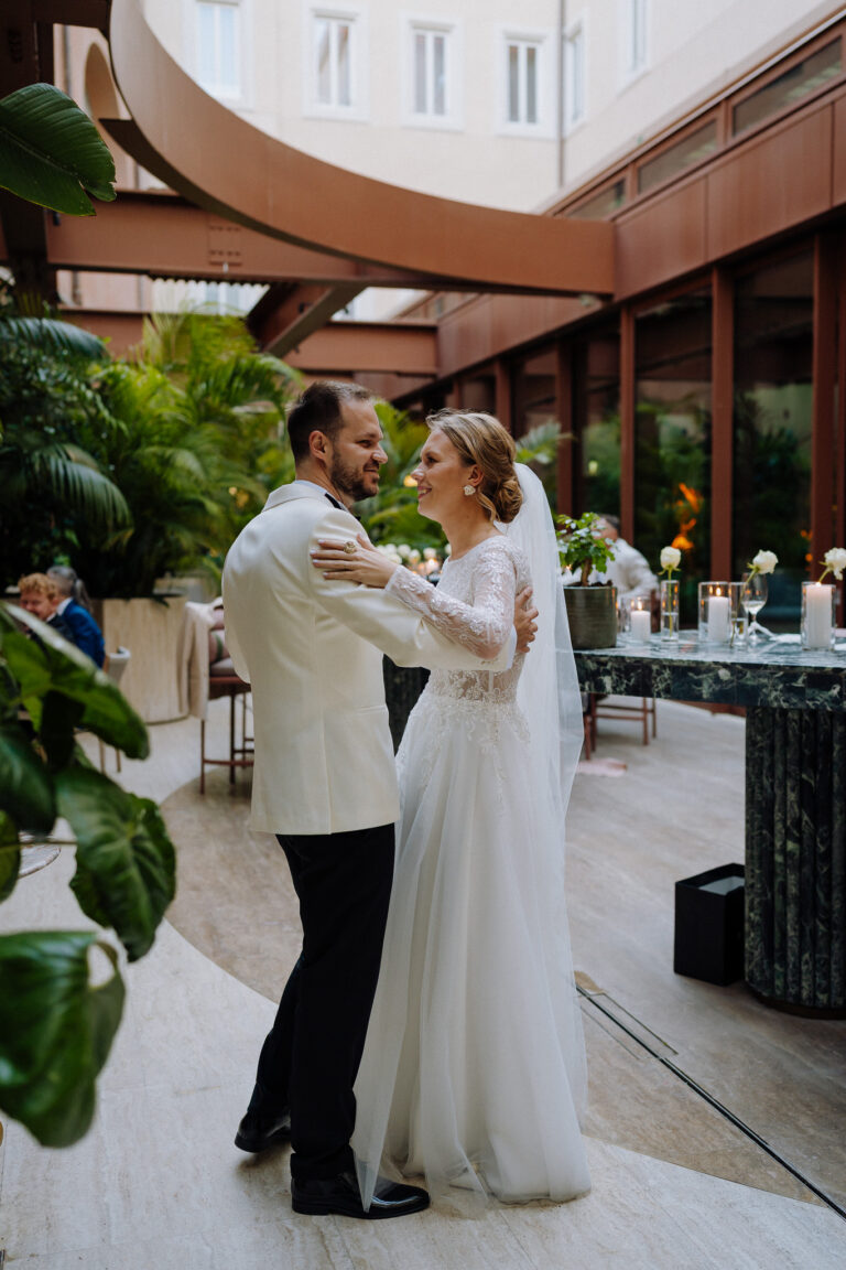 Bride and groom together at Six Senses Rome, warm indoor light and greenery