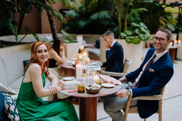 Guests seated for dinner at Six Senses Rome, candlelight and conversation.