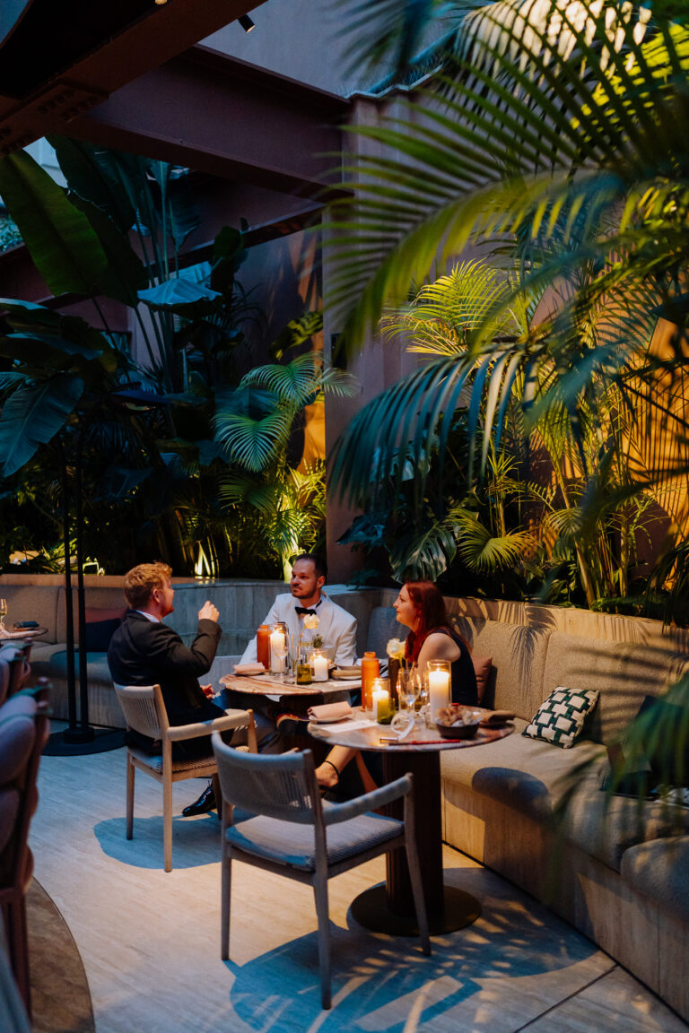 Warm candlelight and greenery details during the Six Senses Rome reception