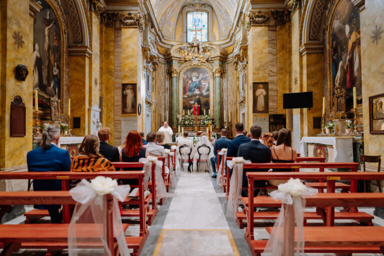 Wedding ceremony moment inside San Stanislao dei Polacchi in Rome.