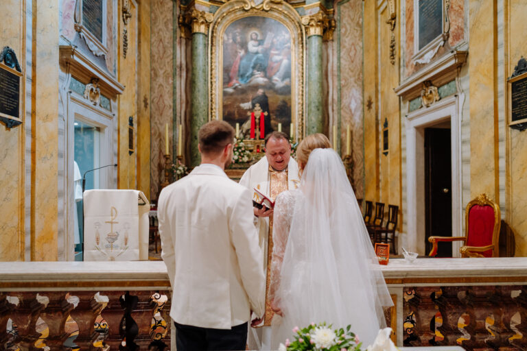 Wedding ceremony moment inside San Stanislao dei Polacchi in Rome.