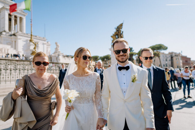 Friends celebrating in Rome after the ceremony, candid joyful atmosphere.
