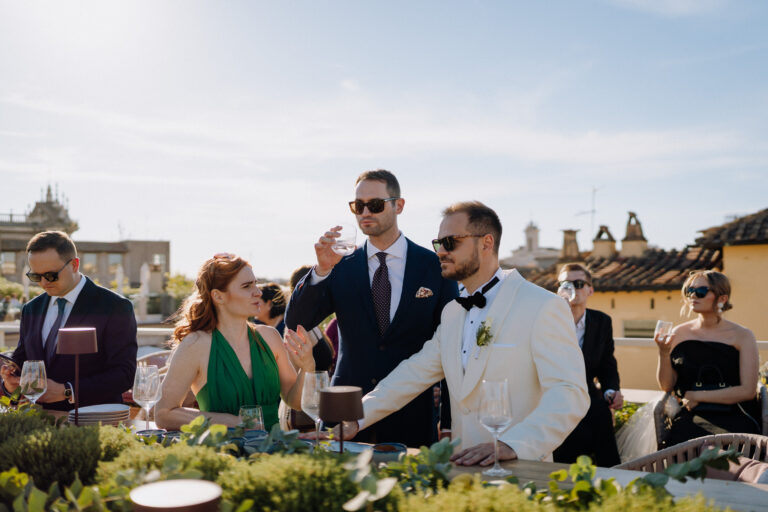 Guests gathered outdoors in Rome, candid moment during the celebration.