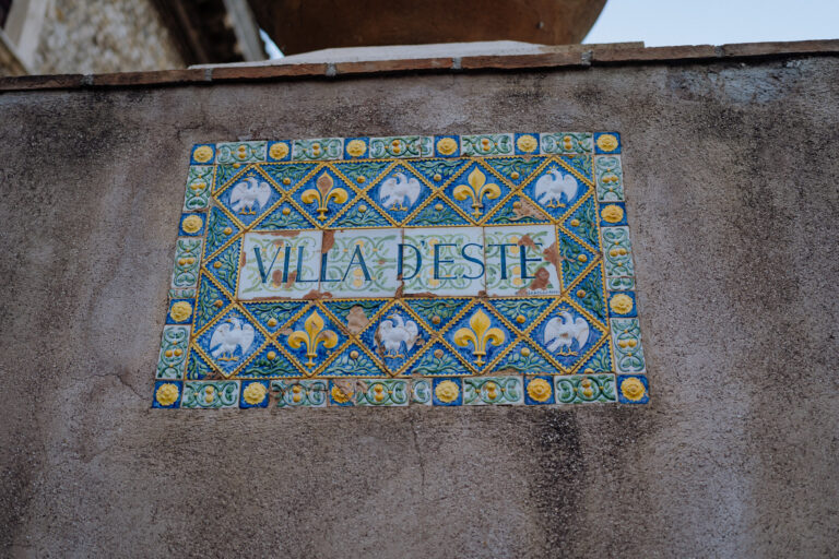 Villa d’Este sign in Tivoli, Italy, destination elopement story detail.