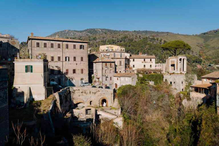 Romantic couple portrait in the streets of Tivoli, Italy, timeless documentary style