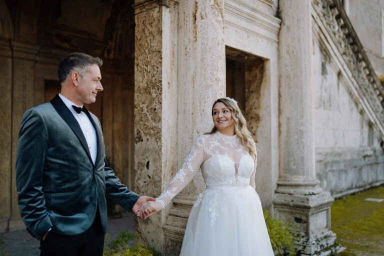 Bride and groom on stone steps in Tivoli, Italy, natural movement and light