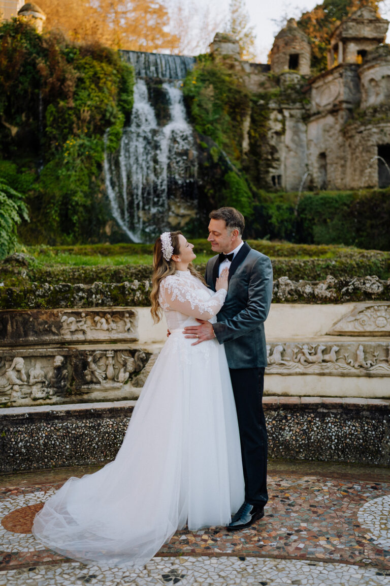 Couple portraits at Villa d’Este gardens in Tivoli, Italy, romantic setting.