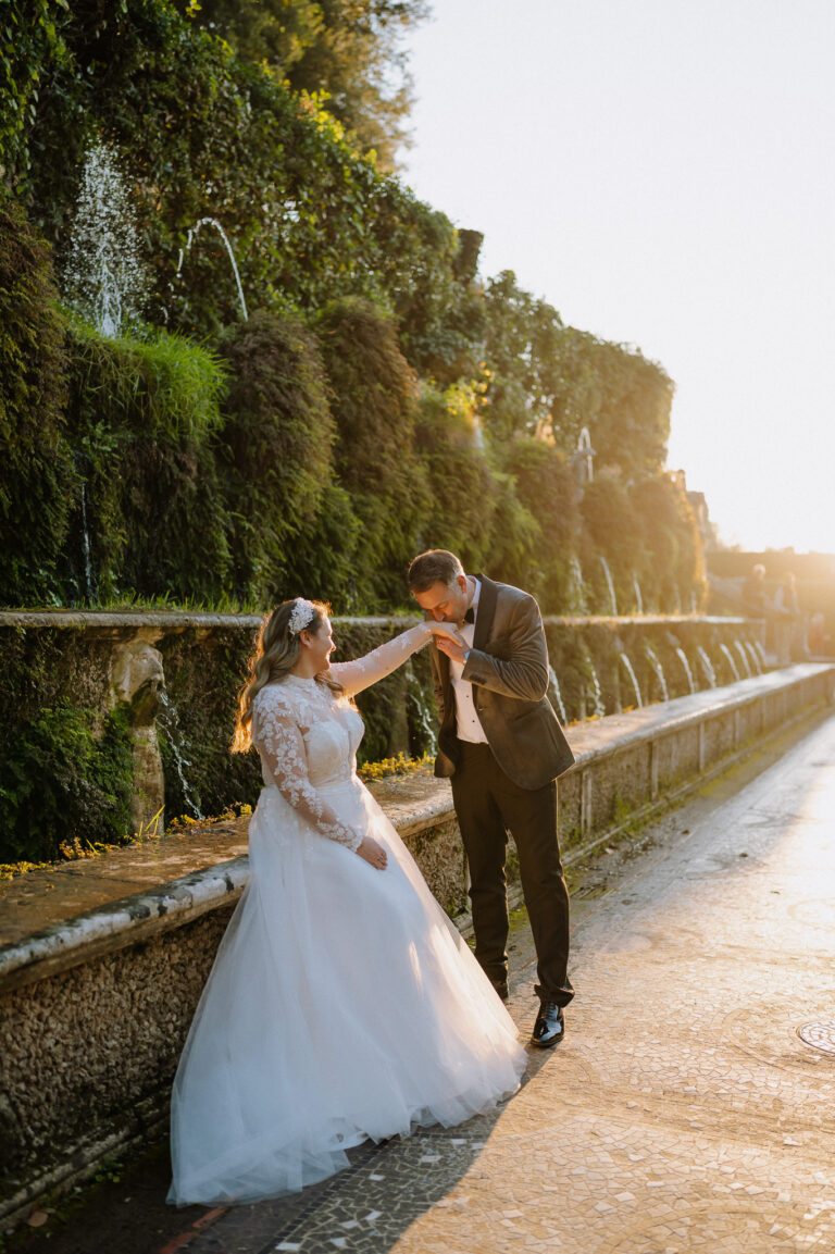 Bride and groom walking near Villa d’Este, Tivoli, soft winter light.