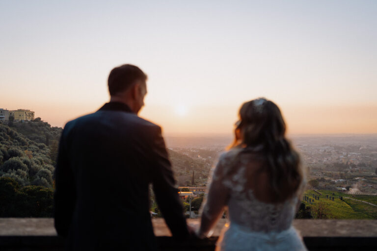 Silhouette of a couple at sunset in Tivoli, Italy, cinematic elopement mood.