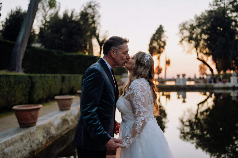 Couple portrait reflected in water at Villa d’Este, Tivoli, Italy