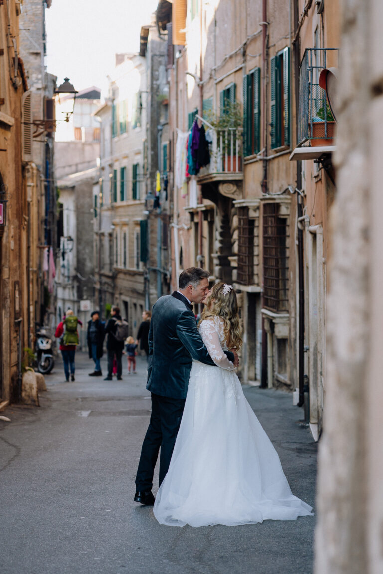 Bride and groom walking through Tivoli streets after their elopement ceremony