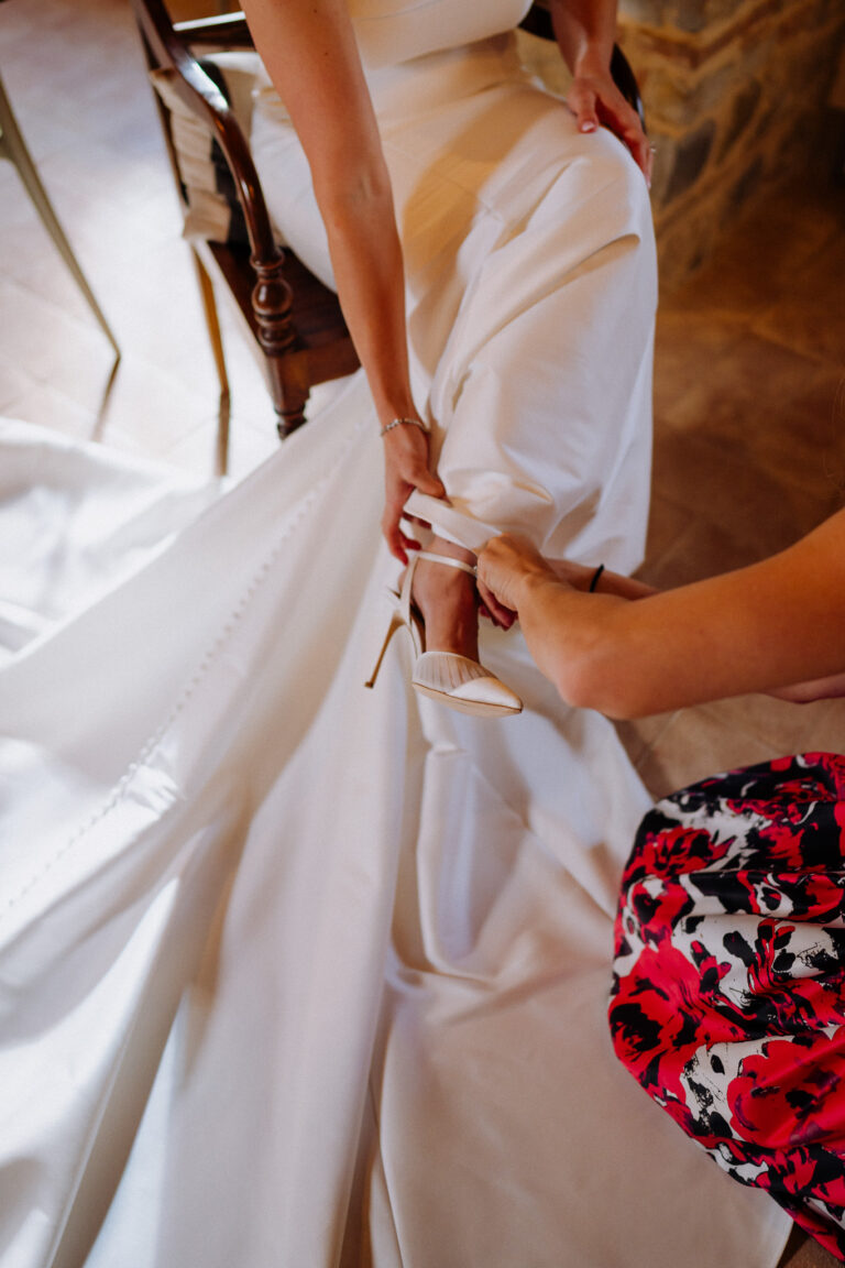 Bride shoes detail during getting ready in Tuscany