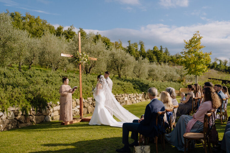 Guests seated for the ceremony in the Tuscan countryside.