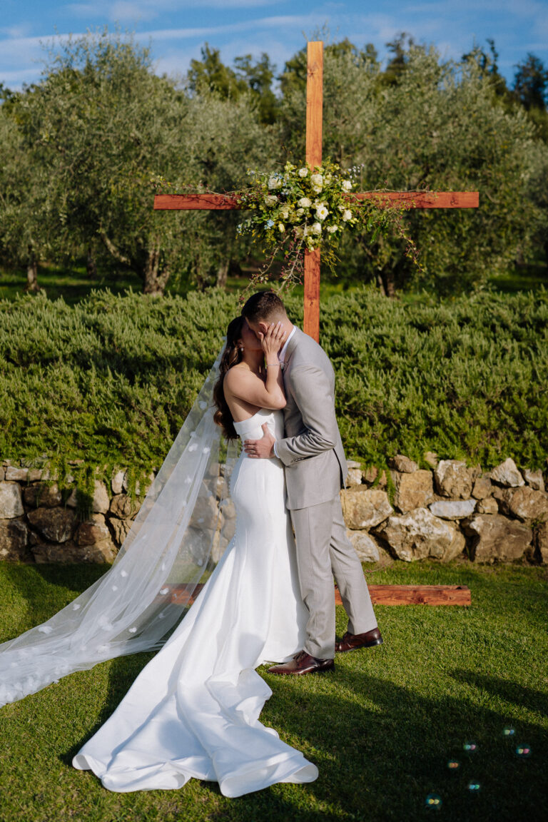 Bride and groom kiss after the ceremony, Tuscany