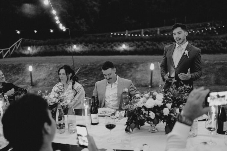 Black and white dinner moment, speeches and laughter