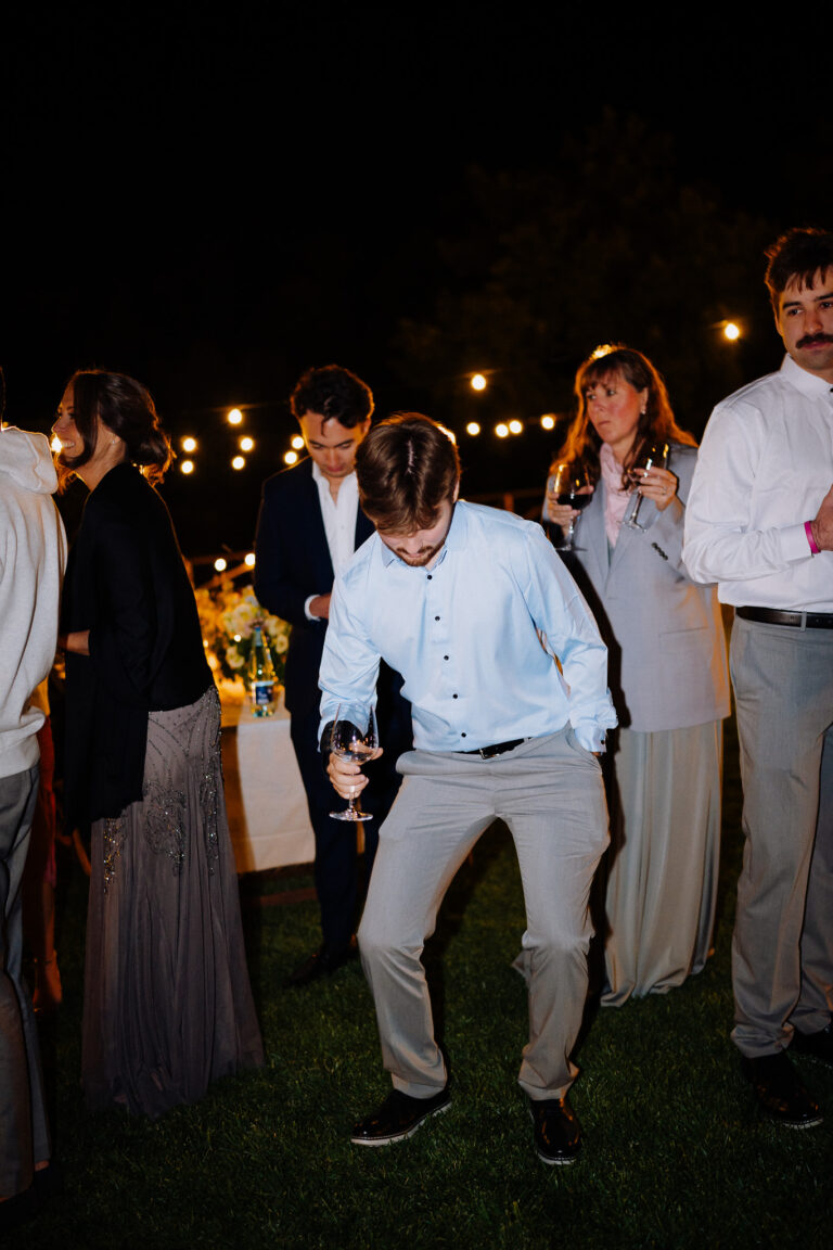 Fun candid moment with friends, wedding party at night