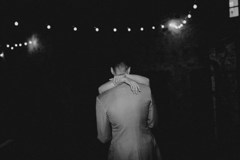 Candid dance moment in low light, wedding party