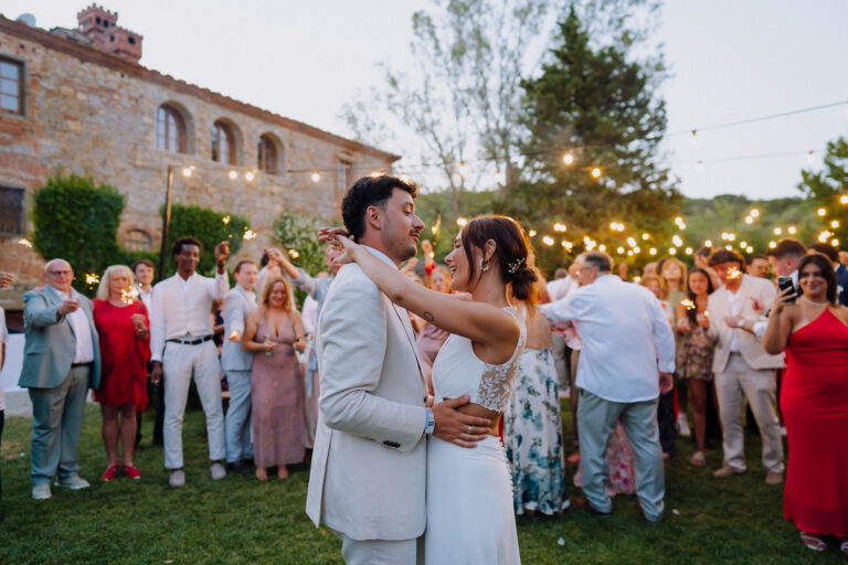 Couple night portrait with guests, Tuscany