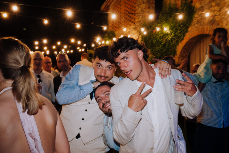 Guest dancing and laughing at night, Tuscany