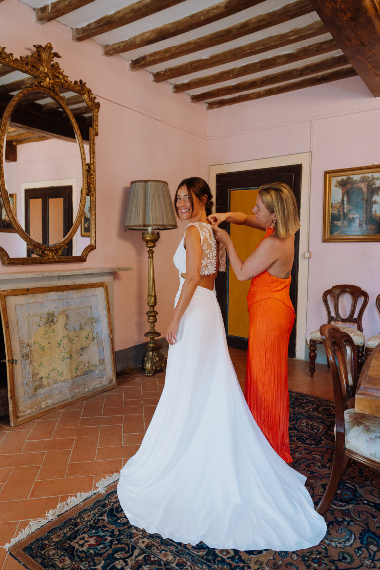 Bride getting ready in a Tuscany villa, quiet moment.