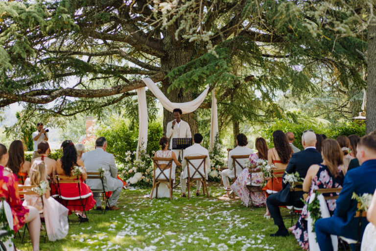 Outdoor ceremony under trees at Villa Cini, Tuscany