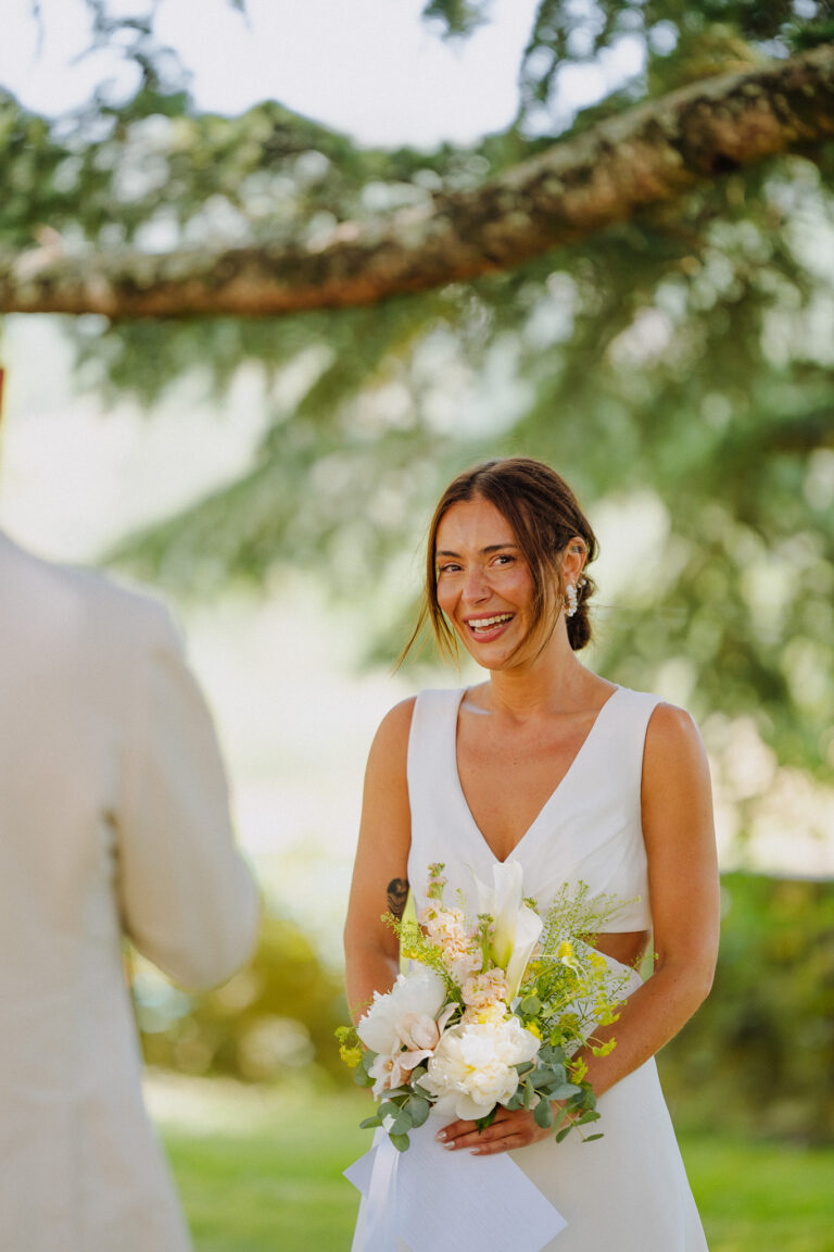 Bride during the ceremony under trees, Tuscany