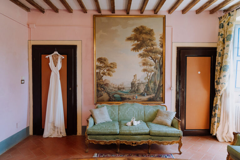 Wedding dress hanging inside Villa Cini, Tuscany