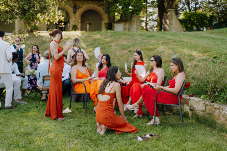 Group of friends seated outdoors, Tuscany